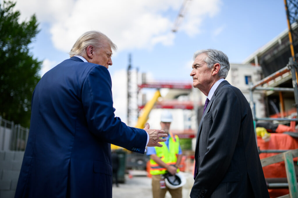 President Donald Trump speaks to Fed Chair Jerome Powell